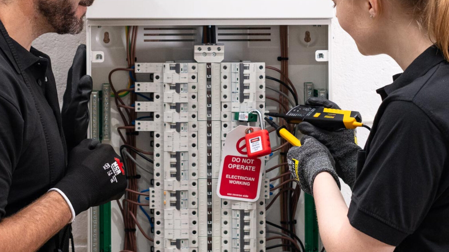 electricians carrying out safe isolation process